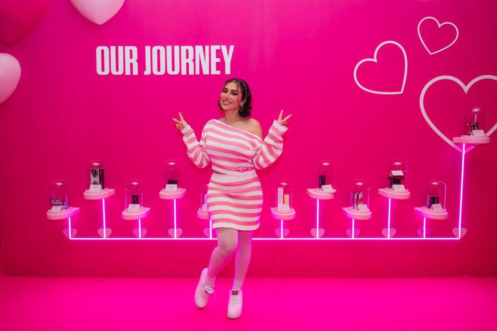 Huda Kattan and her Discovery Wall at Huda Beauty 12th Year Anniversary